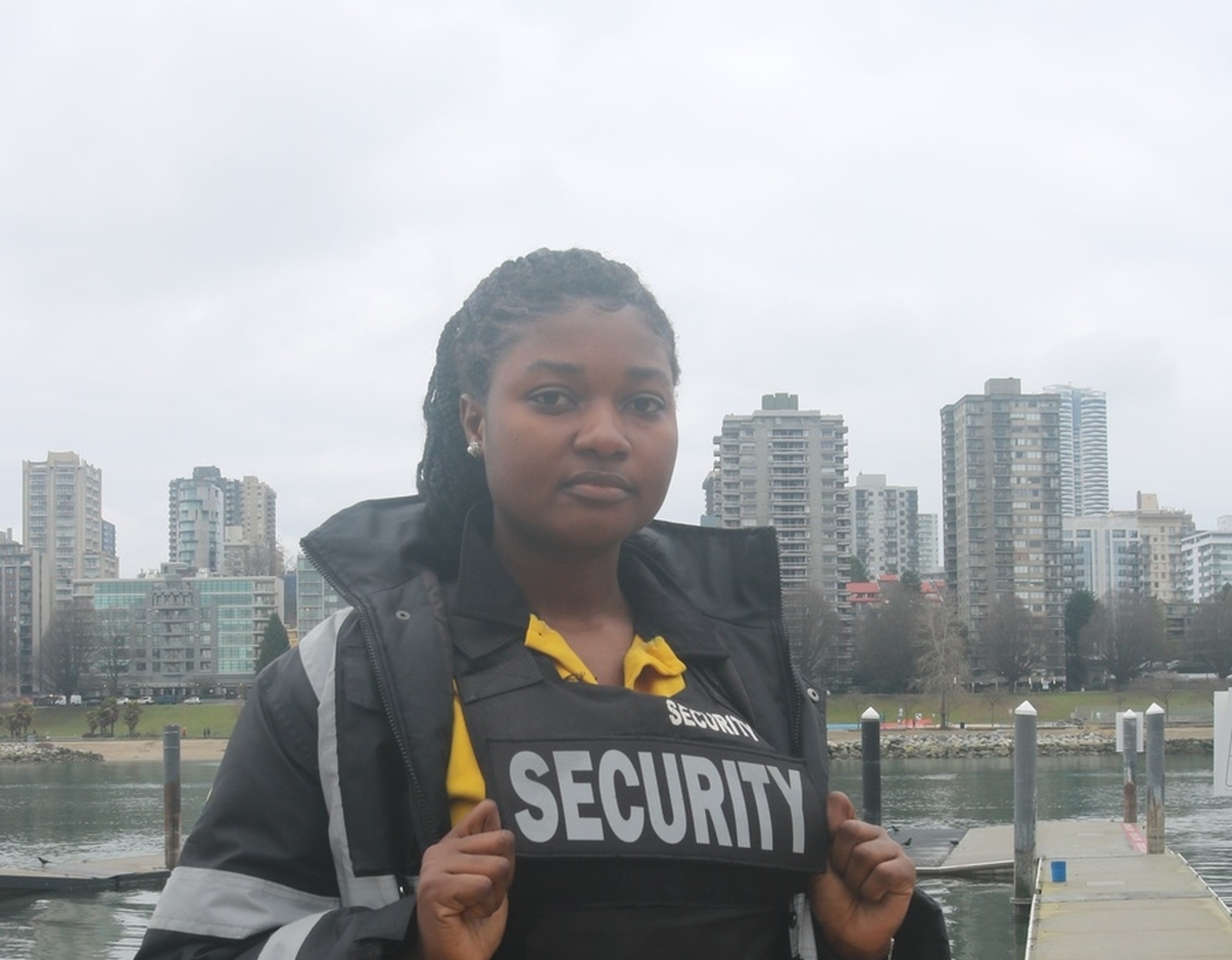 Security personnel in Abbotsford waterfront area with city skyline